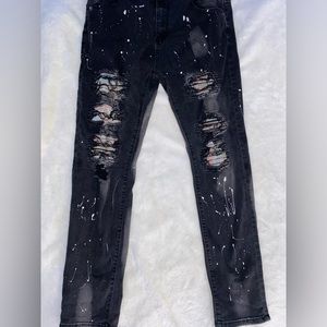 Multi color paint splatter ripped jeans